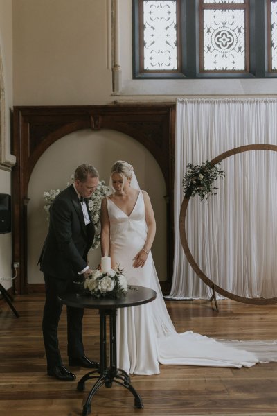 Bride groom lighting candle ceremony