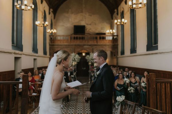 Bride groom reading speech candles flowers