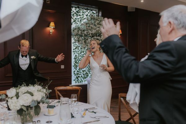 Bride laughing cheers clapping