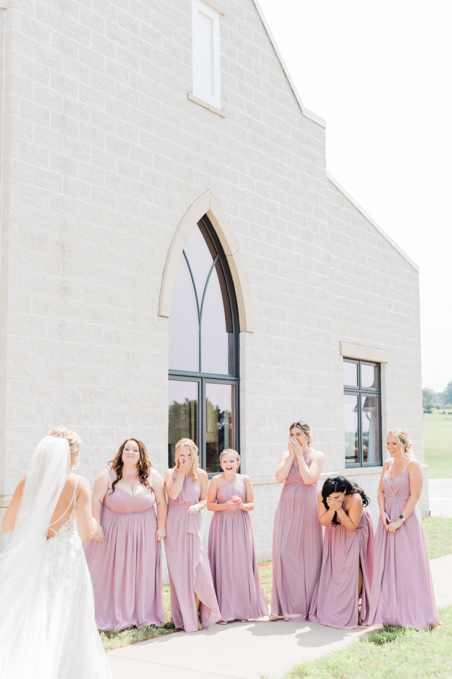 first look bride and bridesmaids