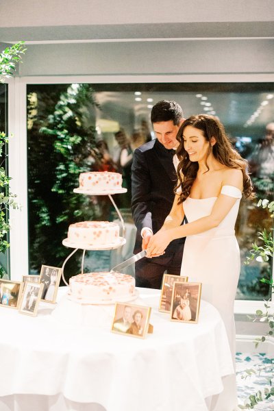 bride and groom cutting cake