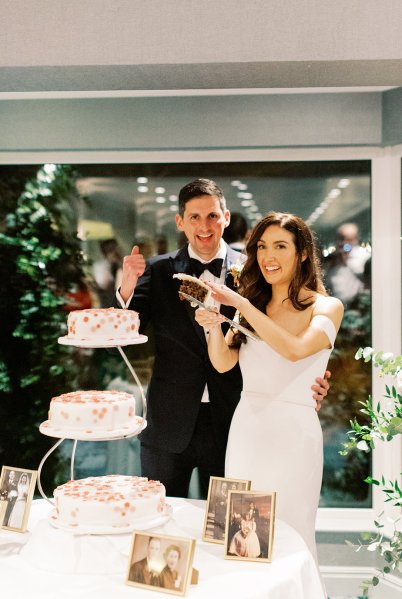 bride and groom cutting cake