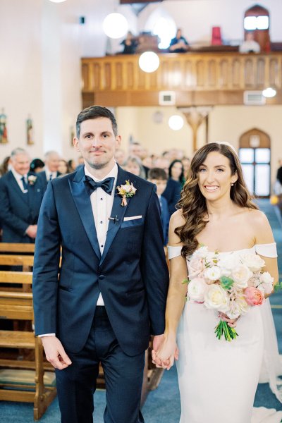 bride and groom walking down aisle