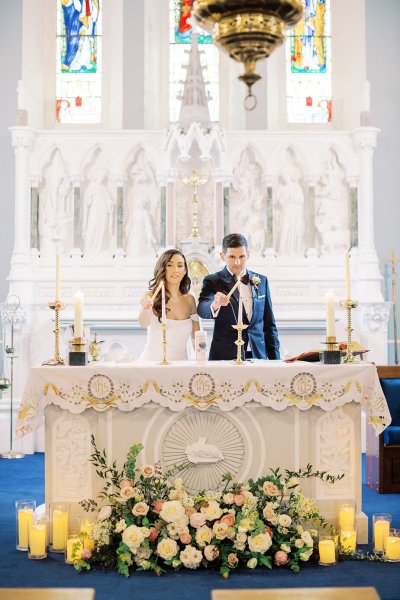 bride and groom at altar