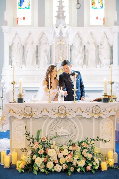 bride and groom at altar