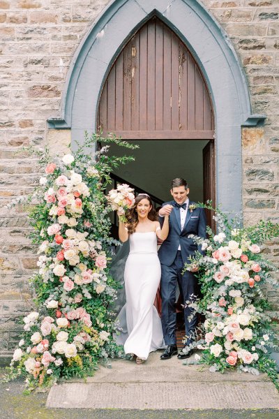 bride and groom church entrance flower pillars