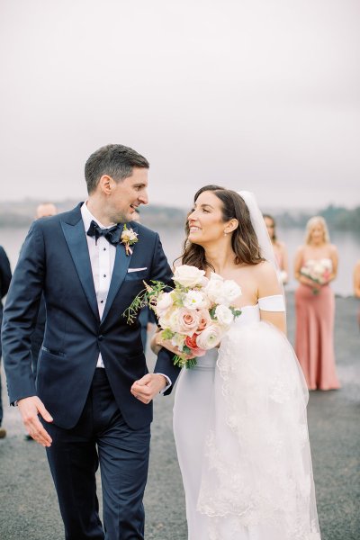 bride and groom walking exterior