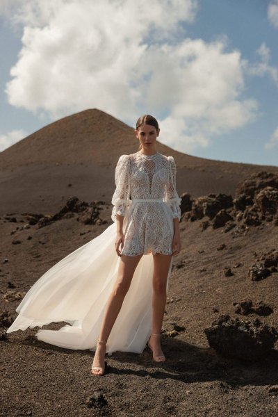 bride model short dress train mountainous scene landscape