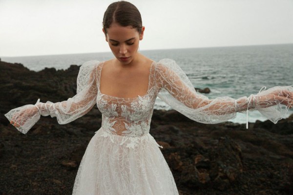 bride in front of sea front beach water