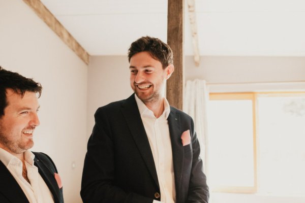 Groom getting ready smiling