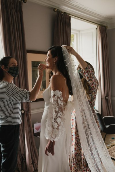 Bride getting ready lace dress veil