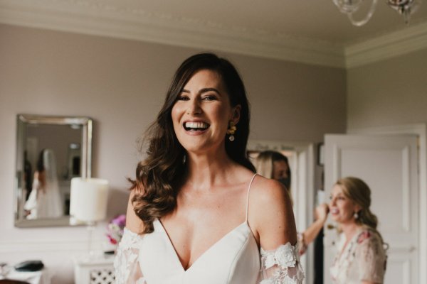 Bride laughing getting ready before ceremony