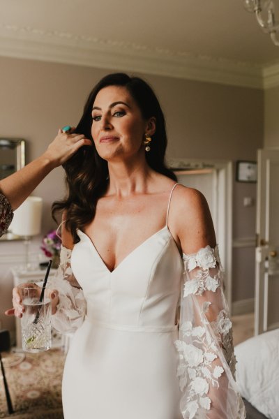 Bride laughing getting ready before ceremony