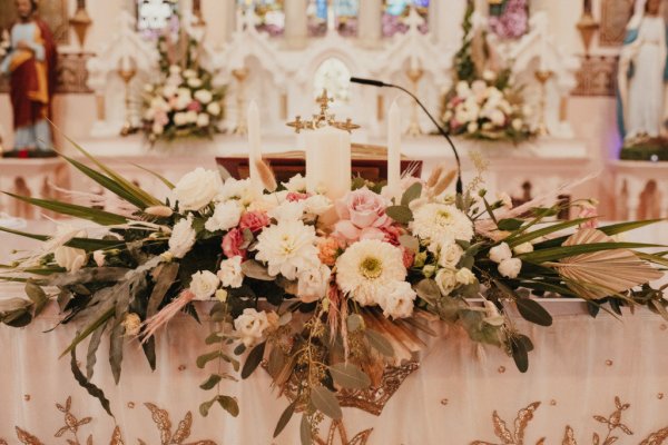 Flower display at alter candle