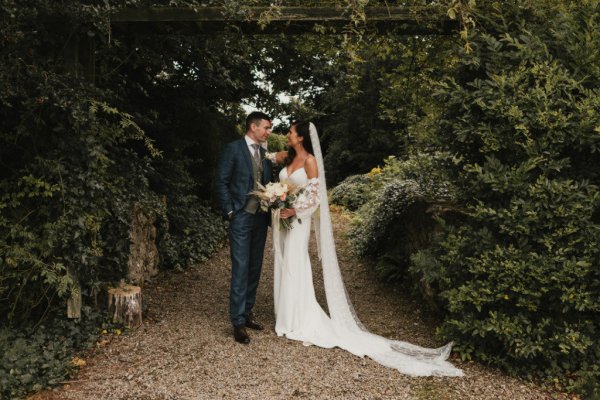 Bride and groom look at each other