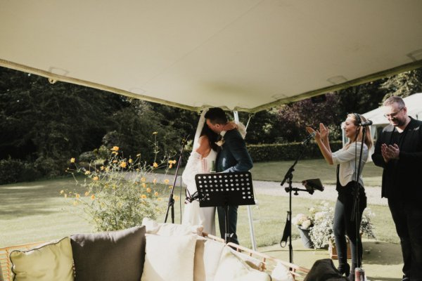 Bride groom kiss exterior