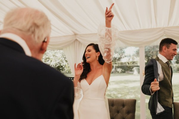 Bride dancing smiling celebrating