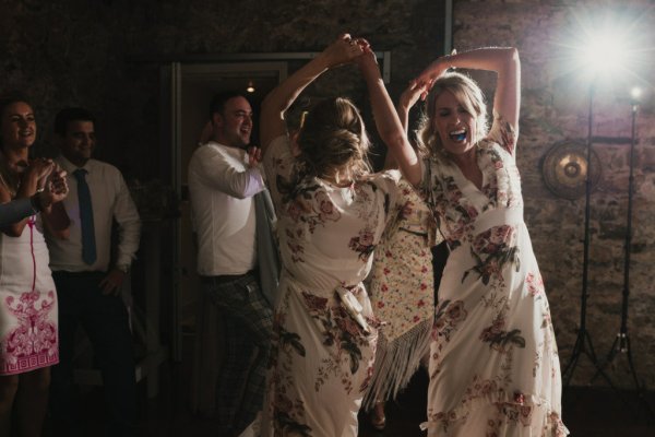 Guests smiling bride dancing