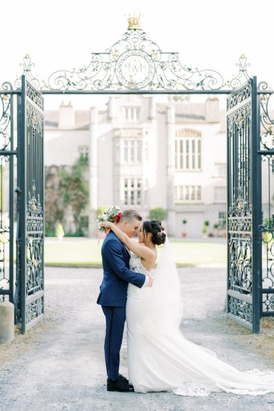 Bride groom exterior veil garden embrace hug