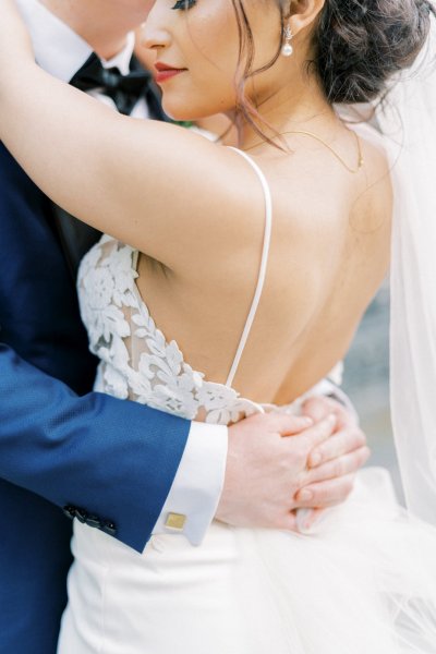 Bride groom exterior veil garden embrace hug