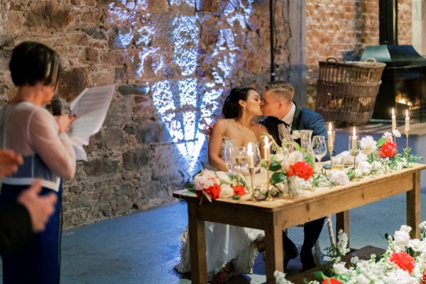 Bride groom kiss during speeches