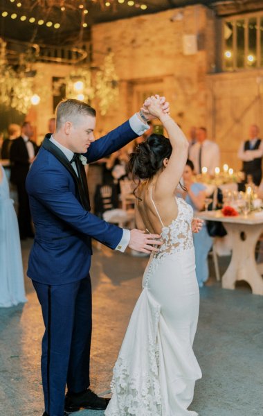 Guitarist wedding band play as bride and groom dance