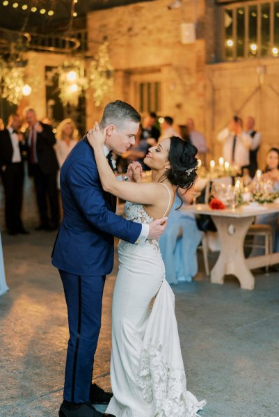 Guitarist wedding band play as bride and groom dance