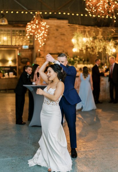 Guitarist wedding band play as bride and groom dance