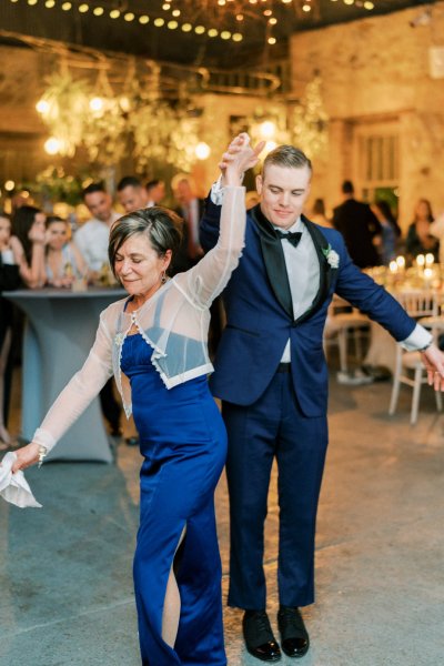 Guitarist wedding band play as groom and mother dance