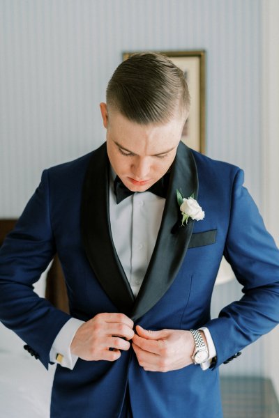 Groom ready suit and tie white flower