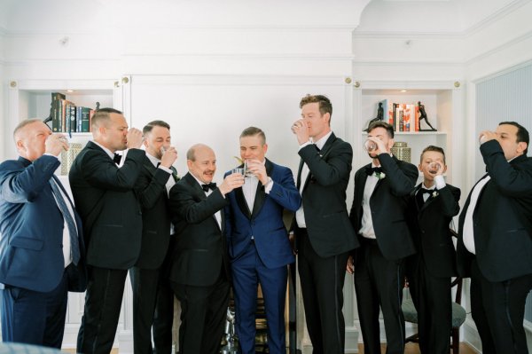 Cheers groom groomsmen before wedding