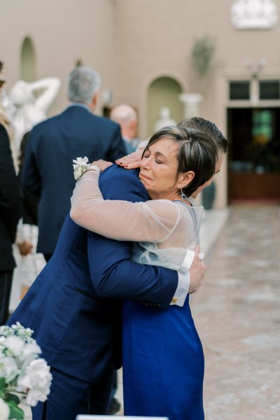 Groom mother hug embrace