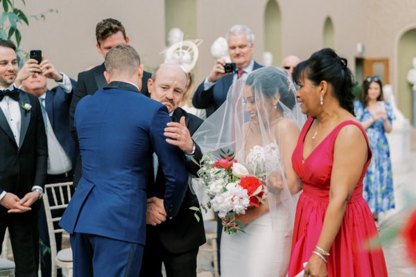 Guests hug bride groom ceremony