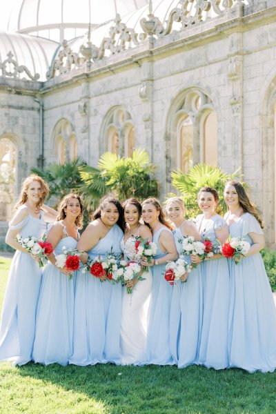 Blue bridesmaids dresses bride rose bouquet flowers