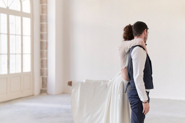 Groom and bride dancing in studio