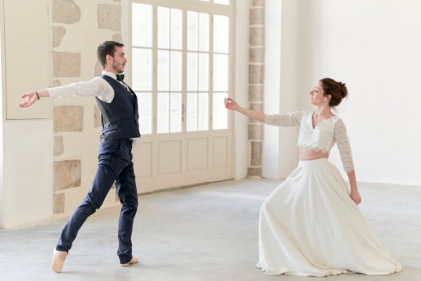 Groom and bride dancing in studio