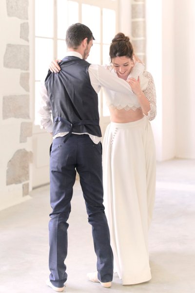 Groom and bride dancing in studio