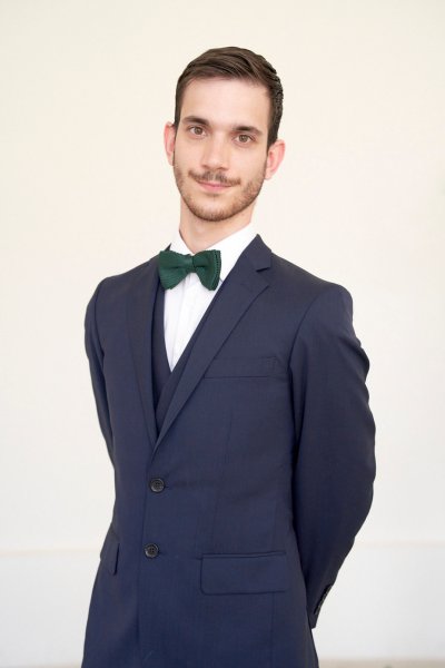 Groom smiling ballet bow tie suit