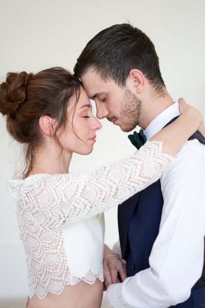 Bride groom embrace suit tie