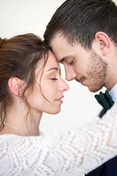 Bride groom embrace suit tie