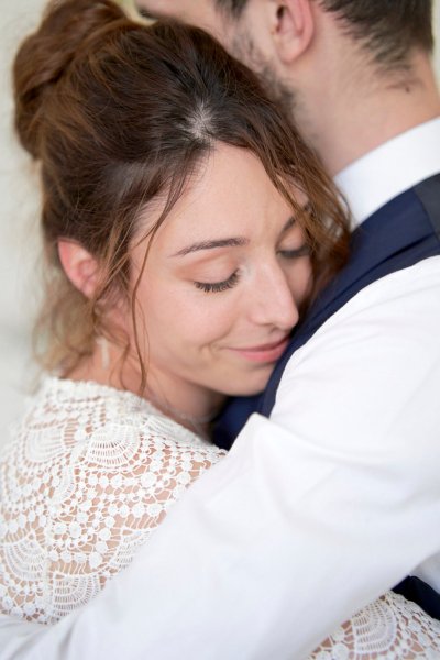 Bride groom embrace suit tie hug