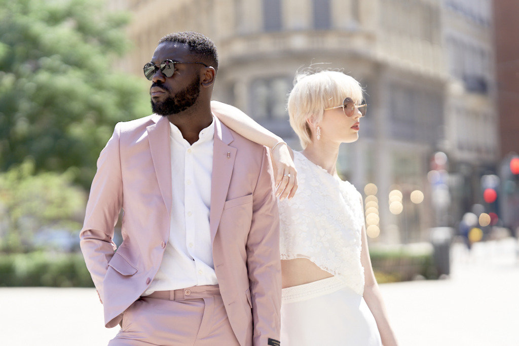 Bride groom pink suit on street