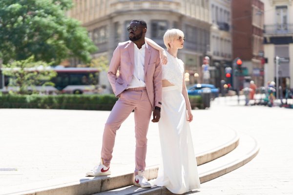 Bride groom pink suit on street