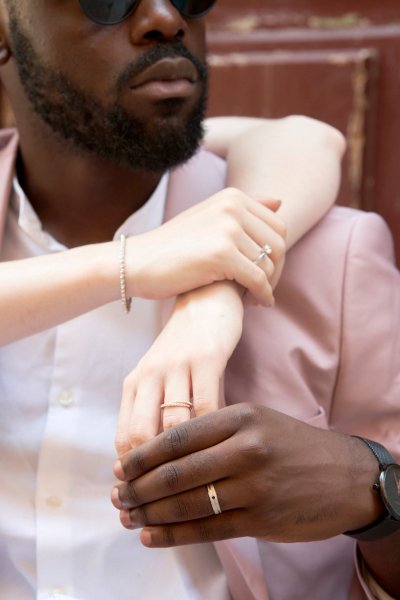 Bride wrapping her arm around groom