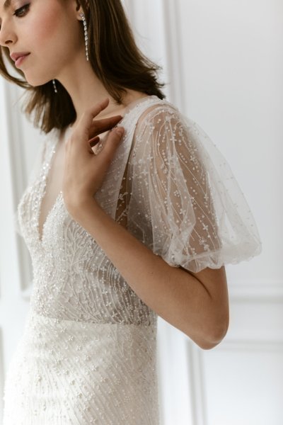 Iris lace sleeves white wedding dress slim fitting close up