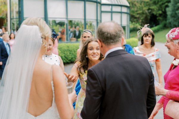 Guests and bride talk