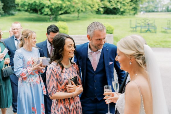 Guests and bride talk