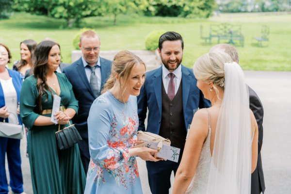 Guests and bride talk