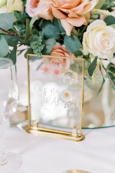 Rose plaque ornament on table flowers