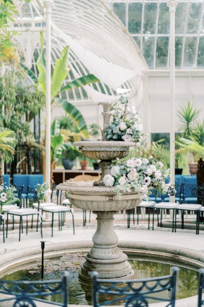 Blue wedding ceremony decor fountain tress flowers